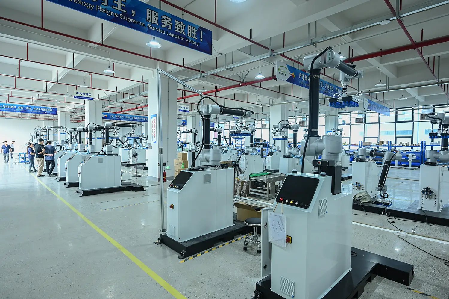 Factory floor with multiple cobot palletizing workstations